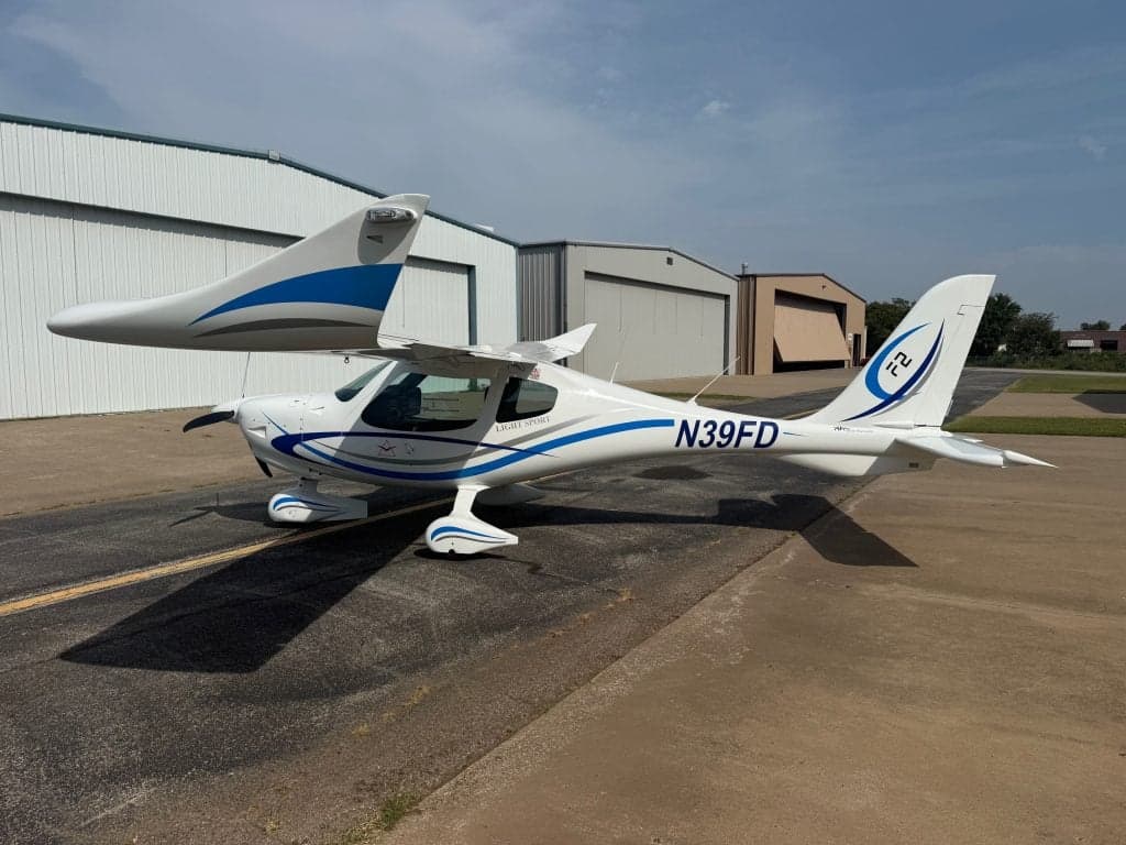 A Flight Design F2 aircraft with registration N39FD parked on the tarmac.