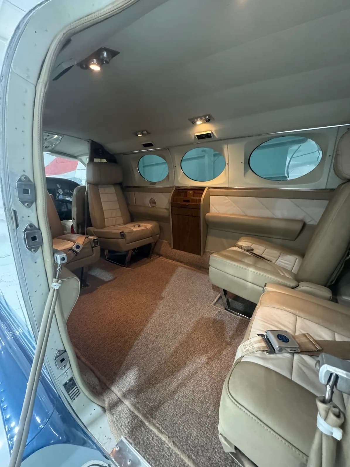 The interior of a Cessna 421 Golden Eagle with tan leather seats.