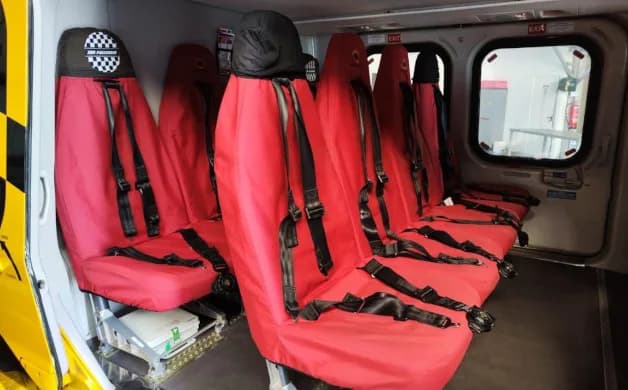 Interior view highlighting the seating arrangement in the helicopter.