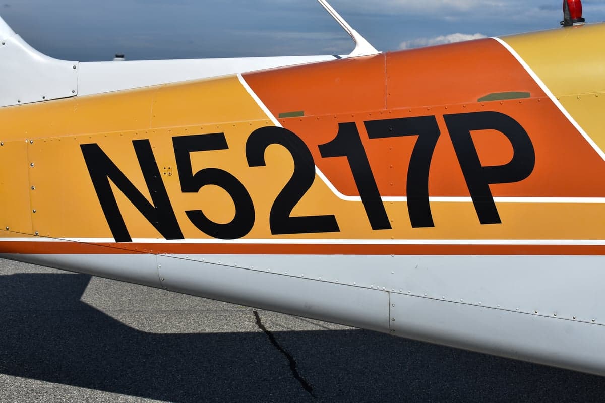 Piper Comanche 250 aircraft, front quarter view, with registration N5217P.