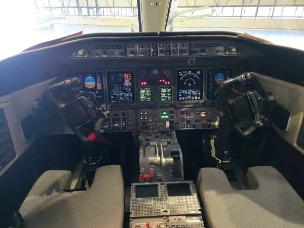 View of the aircraft door and a passenger seat.