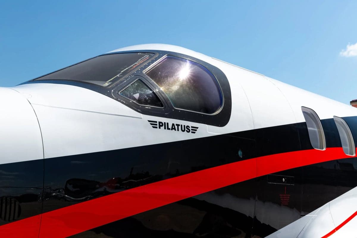 Close up of the cockpit and Pilatus logo on a PC-12 aircraft.
