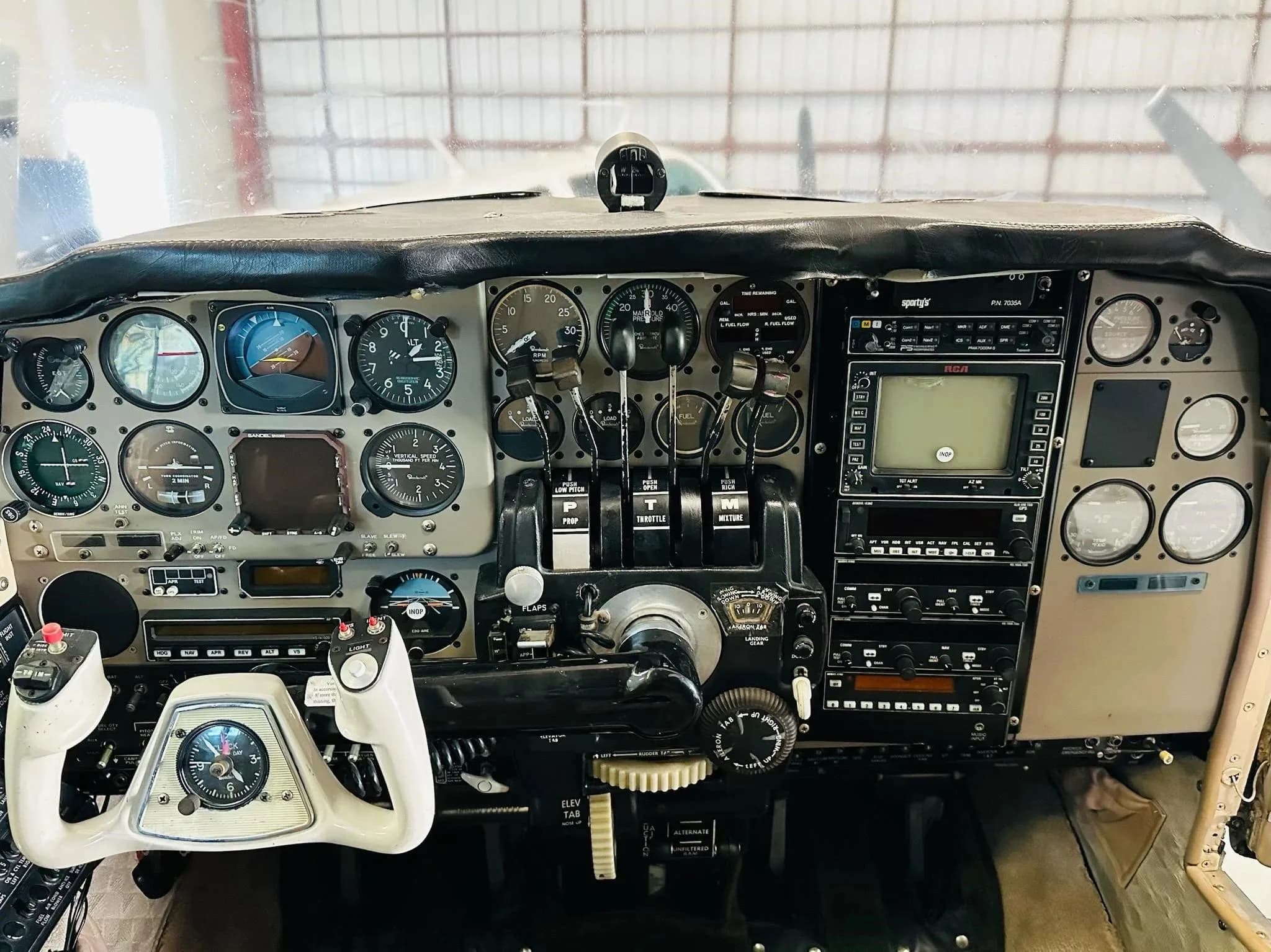 A close-up view of the aircraft's cockpit, highlighting the instrument panel and controls.