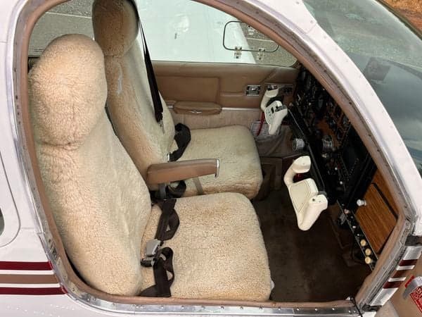 View of the cockpit with sheepskin seat covers.
