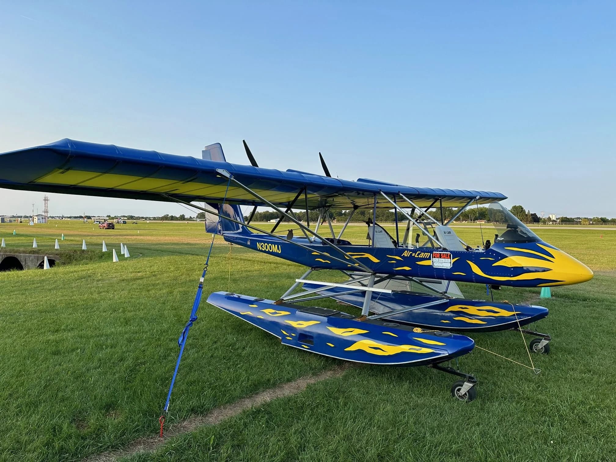 Air-Cam N300MJ on floats parked on the grass.