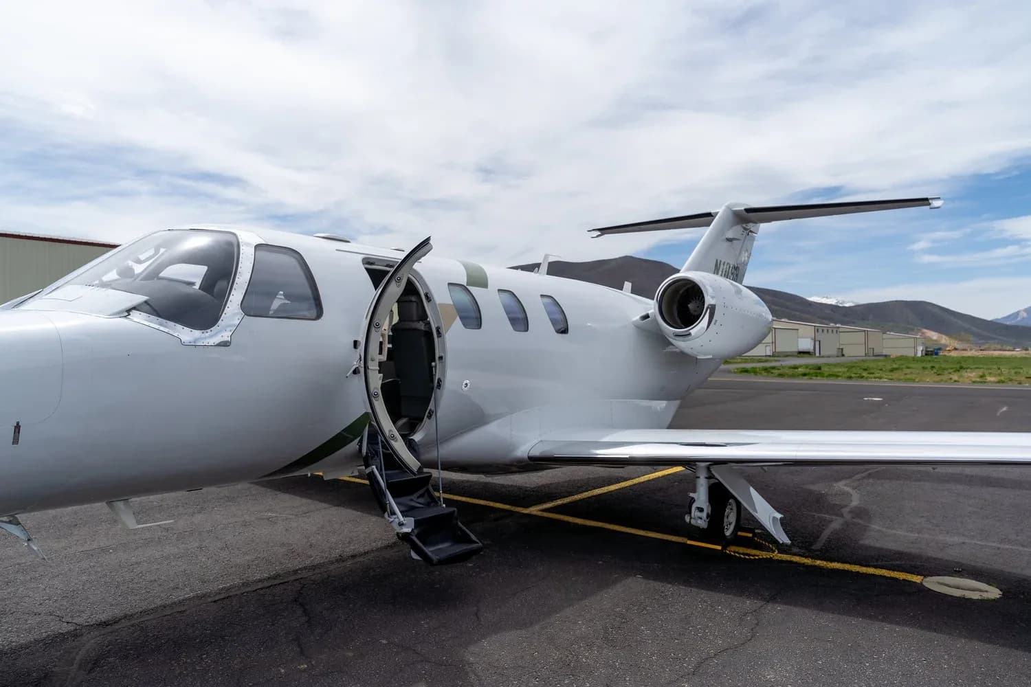 Cessna Citation CJ3+ aircraft N1099 with the entry door open.