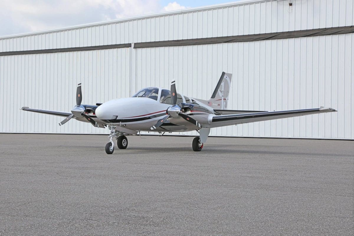 Side view of a Beechcraft Baron G58 aircraft on the ground.