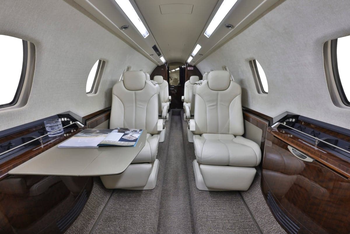 View down the aisle of the aircraft cabin.