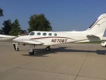 A Cessna 421C Golden Eagle aircraft with registration N2708T parked on the tarmac.