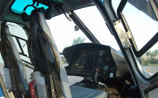 Interior view of the helicopter cabin with seats.