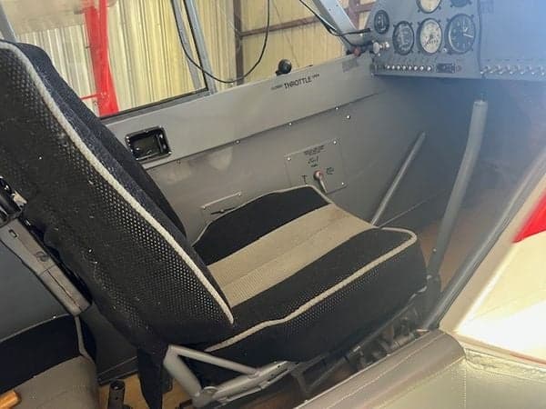 View of the aircraft interior with seat and side panel.