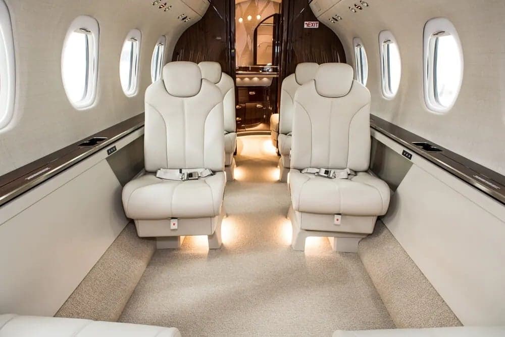Interior view of the aircraft cabin with leather seats.