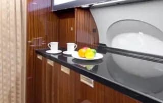 A countertop with refreshments inside the aircraft.