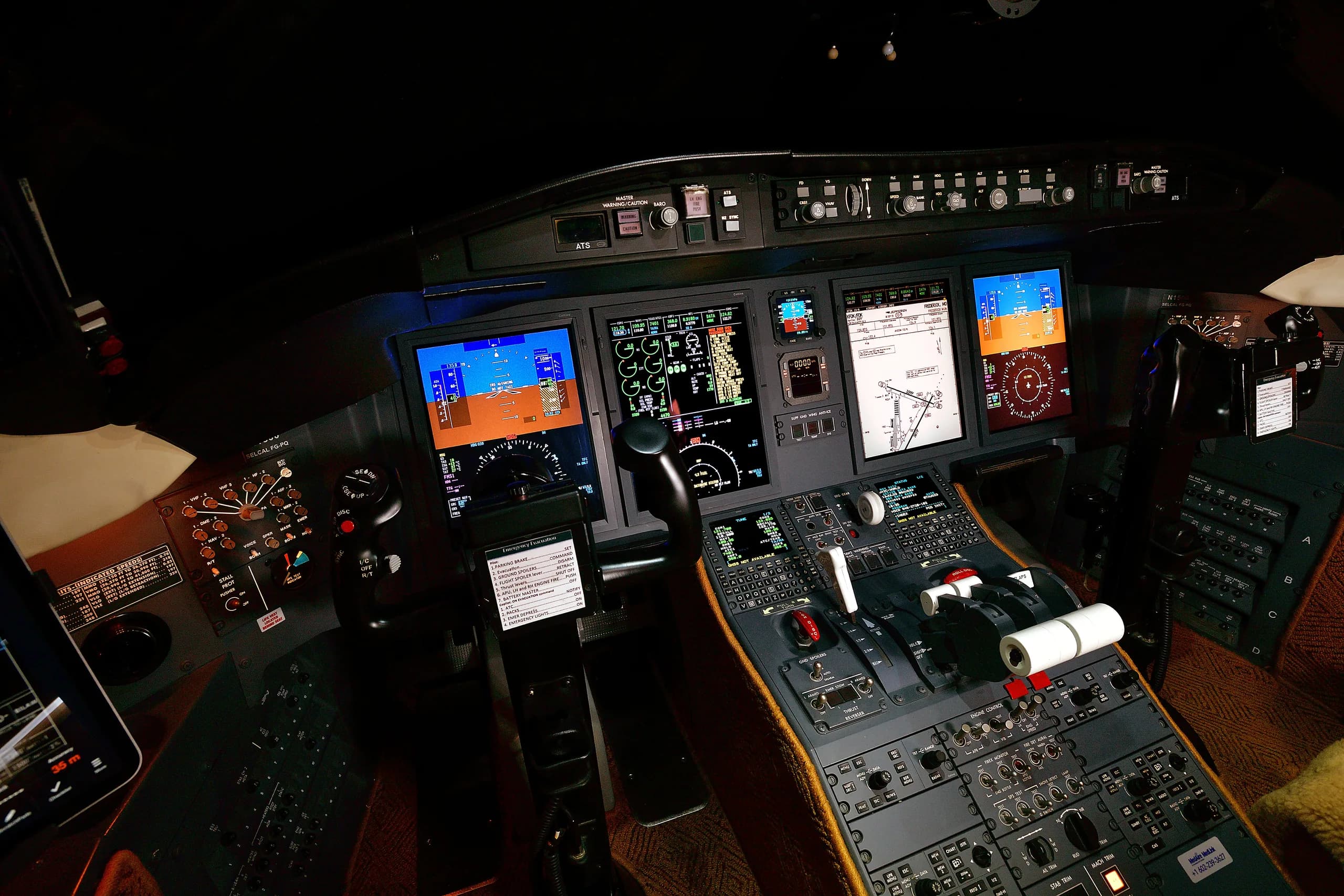 A close-up view of the private jet's cockpit, highlighting the digital instrument panels and the detailed throttle controls.