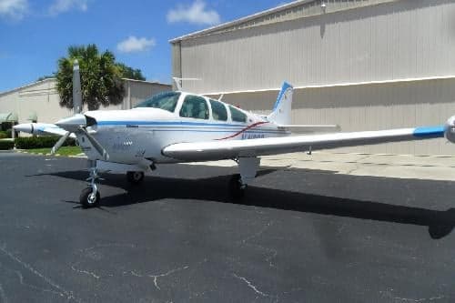 A Beechcraft Bonanza N4166S parked on the tarmac.