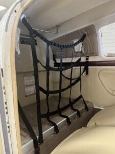 Interior of the aircraft showing a cargo net.