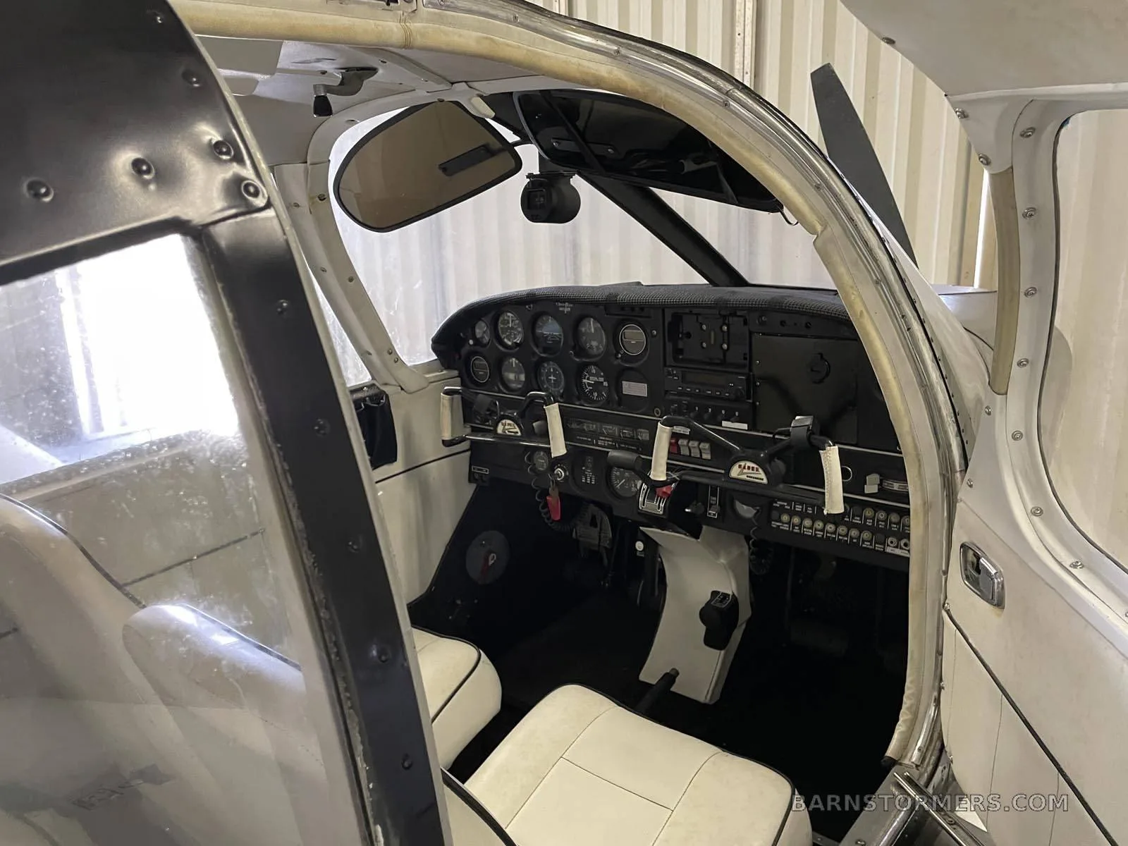 The cockpit showing the instrument panel and controls.