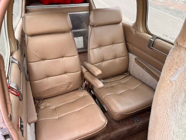 View of the cabin seats with armrests.