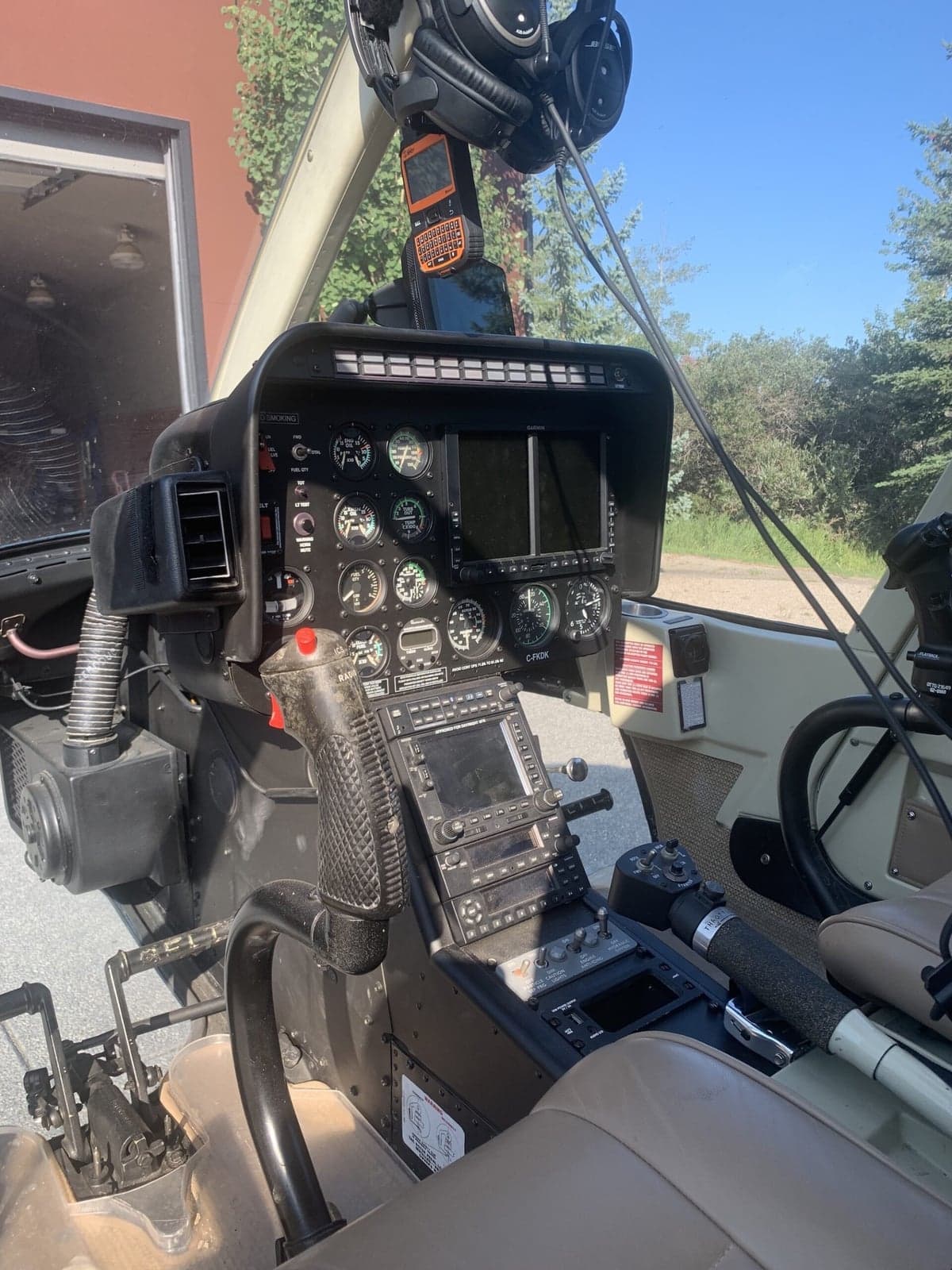 View of the Bell 407 helicopter cockpit with instrument panel and controls.