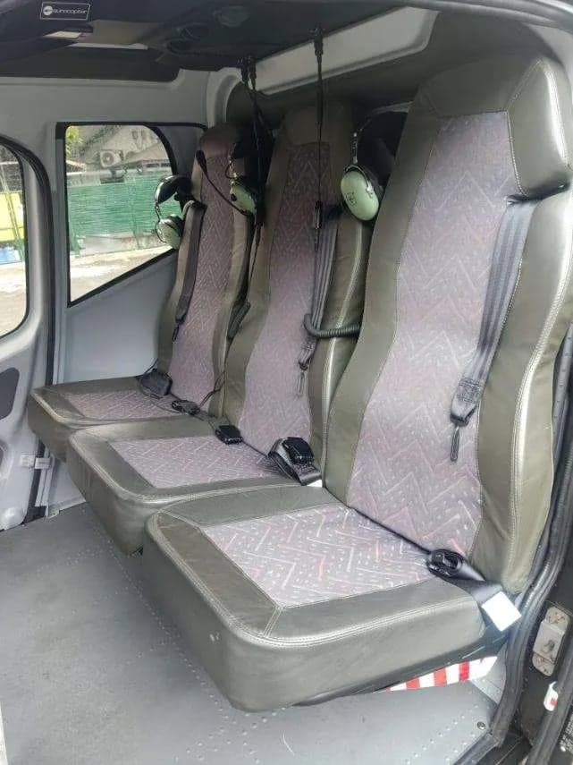 View of the helicopter's interior seats and headsets.