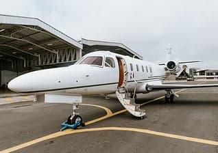 Bombardier Challenger 350 aircraft with registration N910CL on the tarmac.