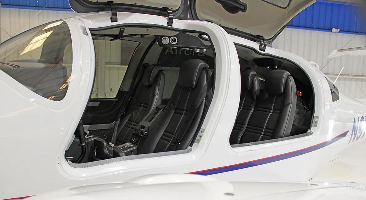 Interior view of the Diamond DA62 cabin with black leather seats.