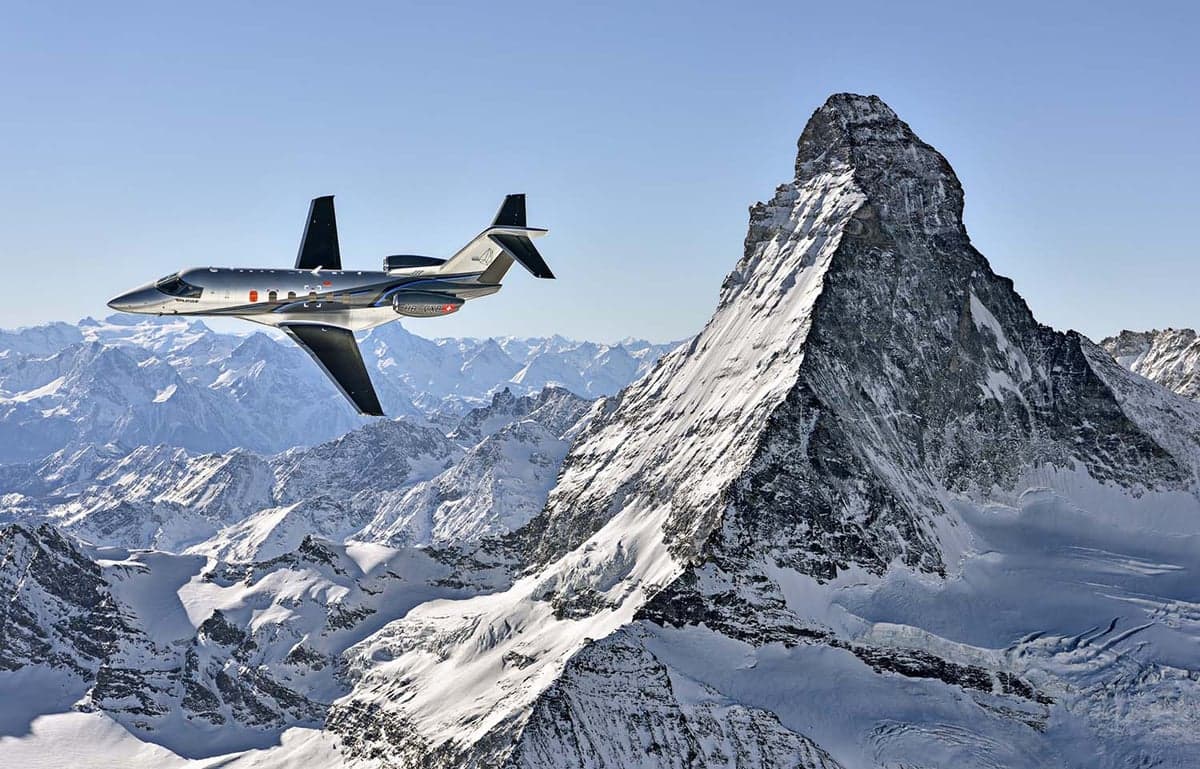 A Pilatus PC-24 flying near the Matterhorn mountain.