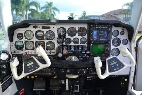 View of the aircraft's instrument panel and control yokes.