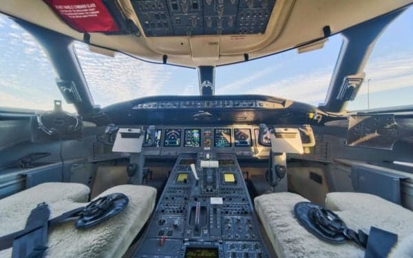 The cockpit of the aircraft features a full instrument panel and seating.