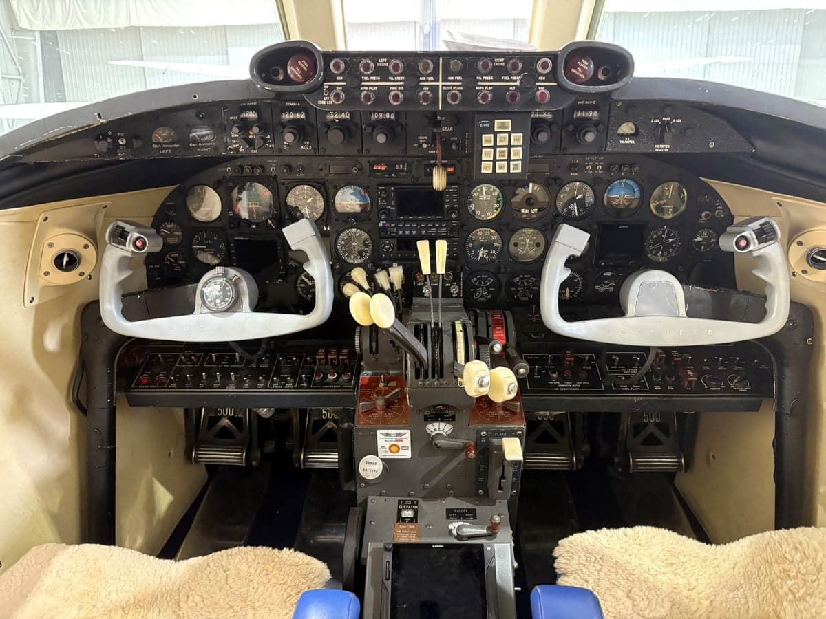 The cockpit of a Beechcraft Model 18, showing the instrument panel and controls.