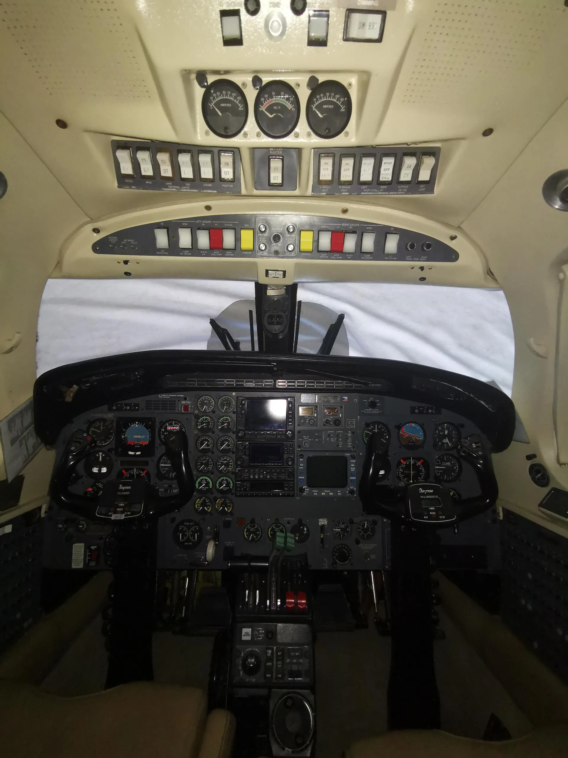 Wide view of the aircraft's instrument panel and controls.