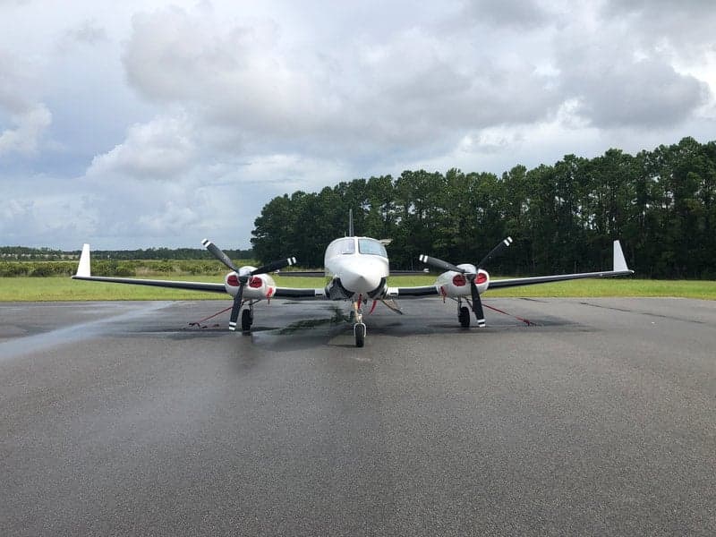 Front view of the N513JN aircraft on the tarmac.
