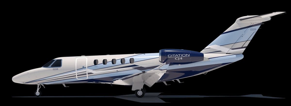 A blue and white Cessna Skylane on a black background.