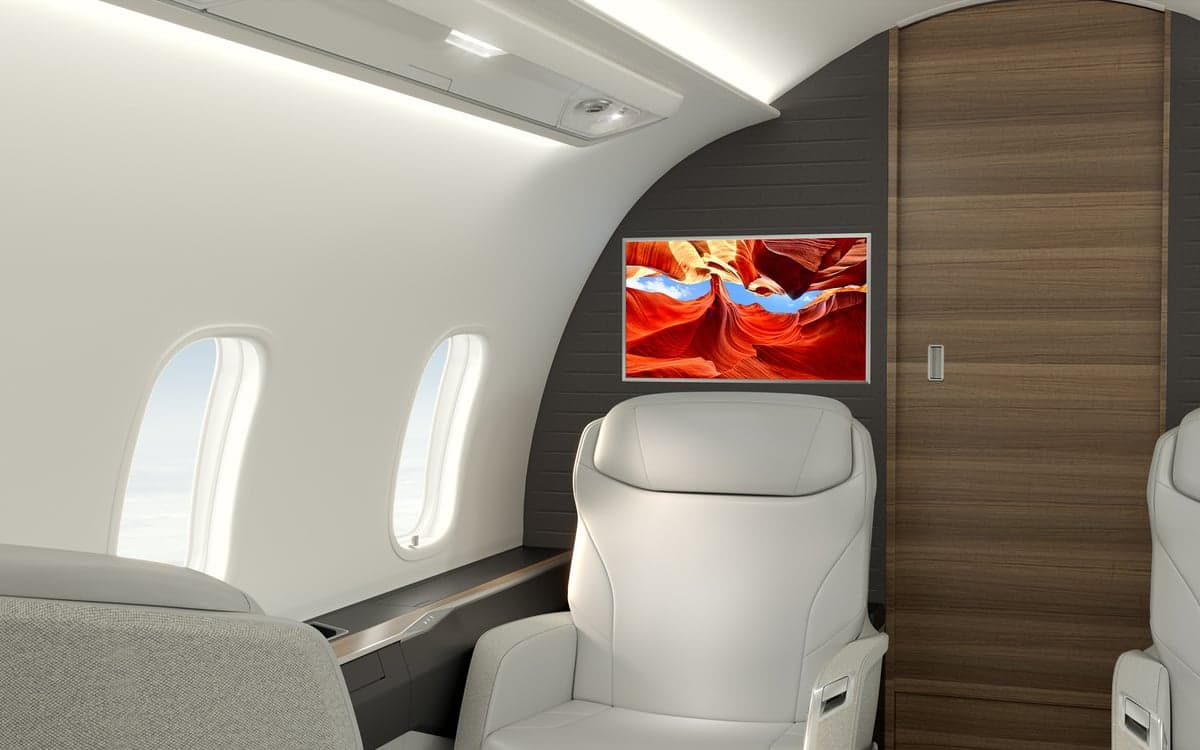 A view of the Challenger 3500 cabin with a TV screen.