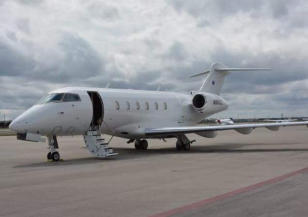 Eclipse 500 aircraft with registration N116MC on the tarmac.