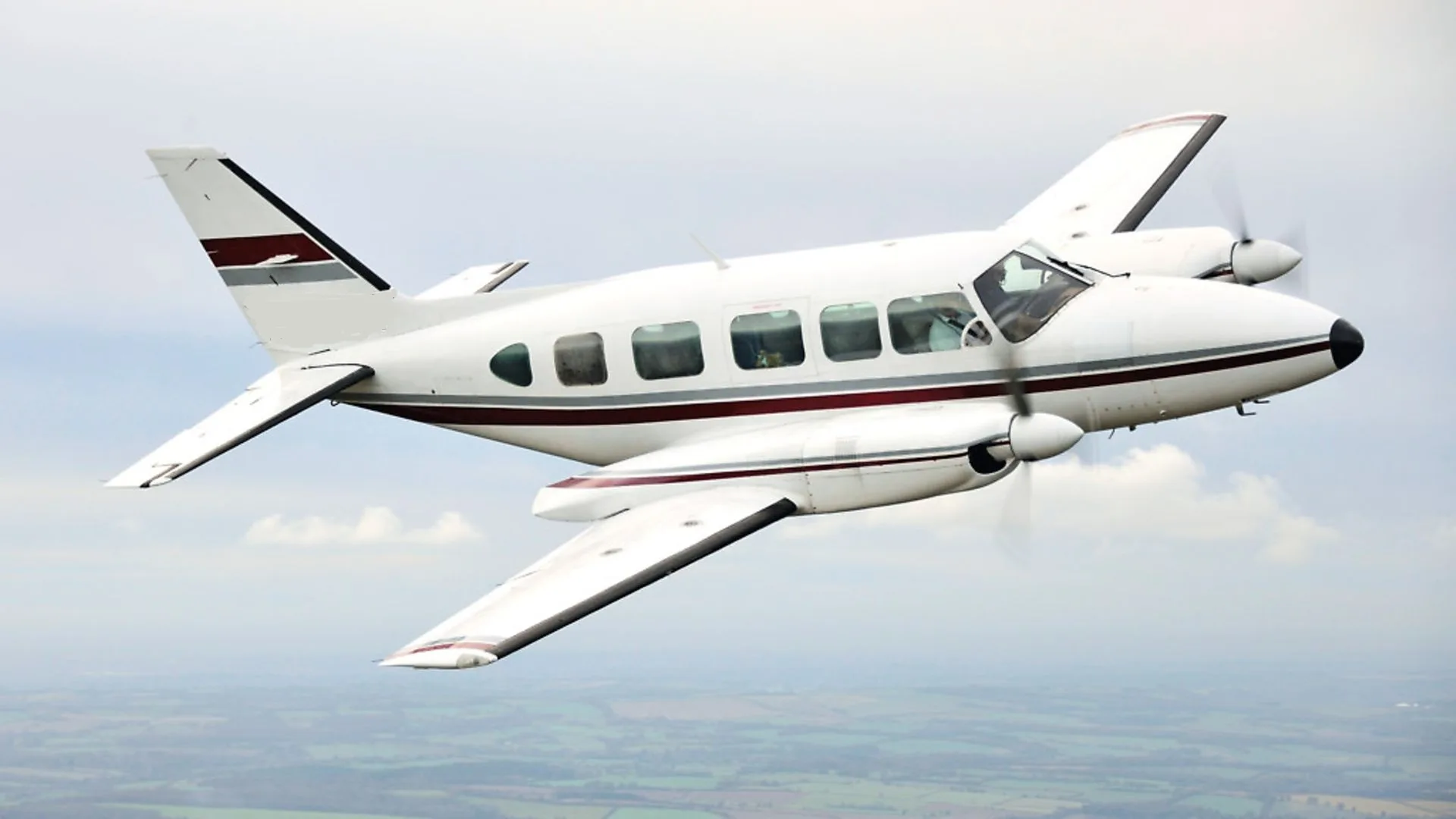 Stock photo of a twin-engine aircraft in flight.