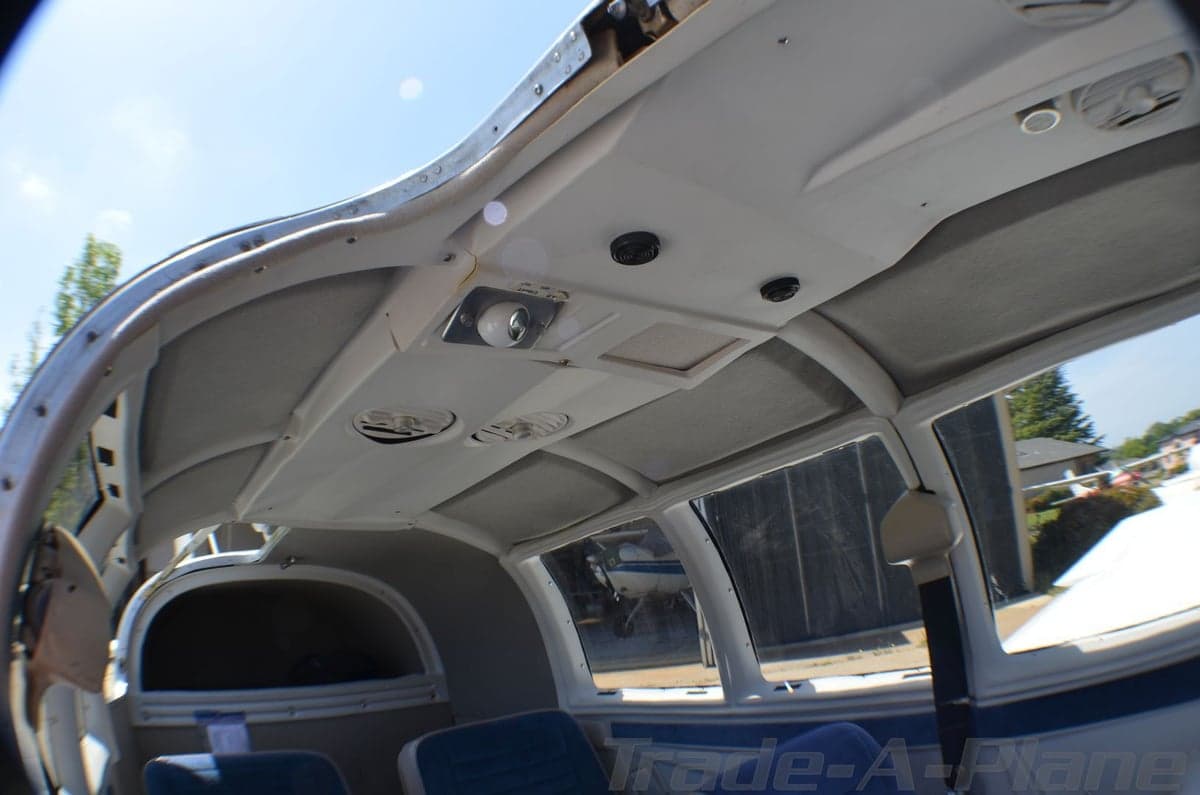 View of the Mooney Executive 21 aircraft's blue interior seats.