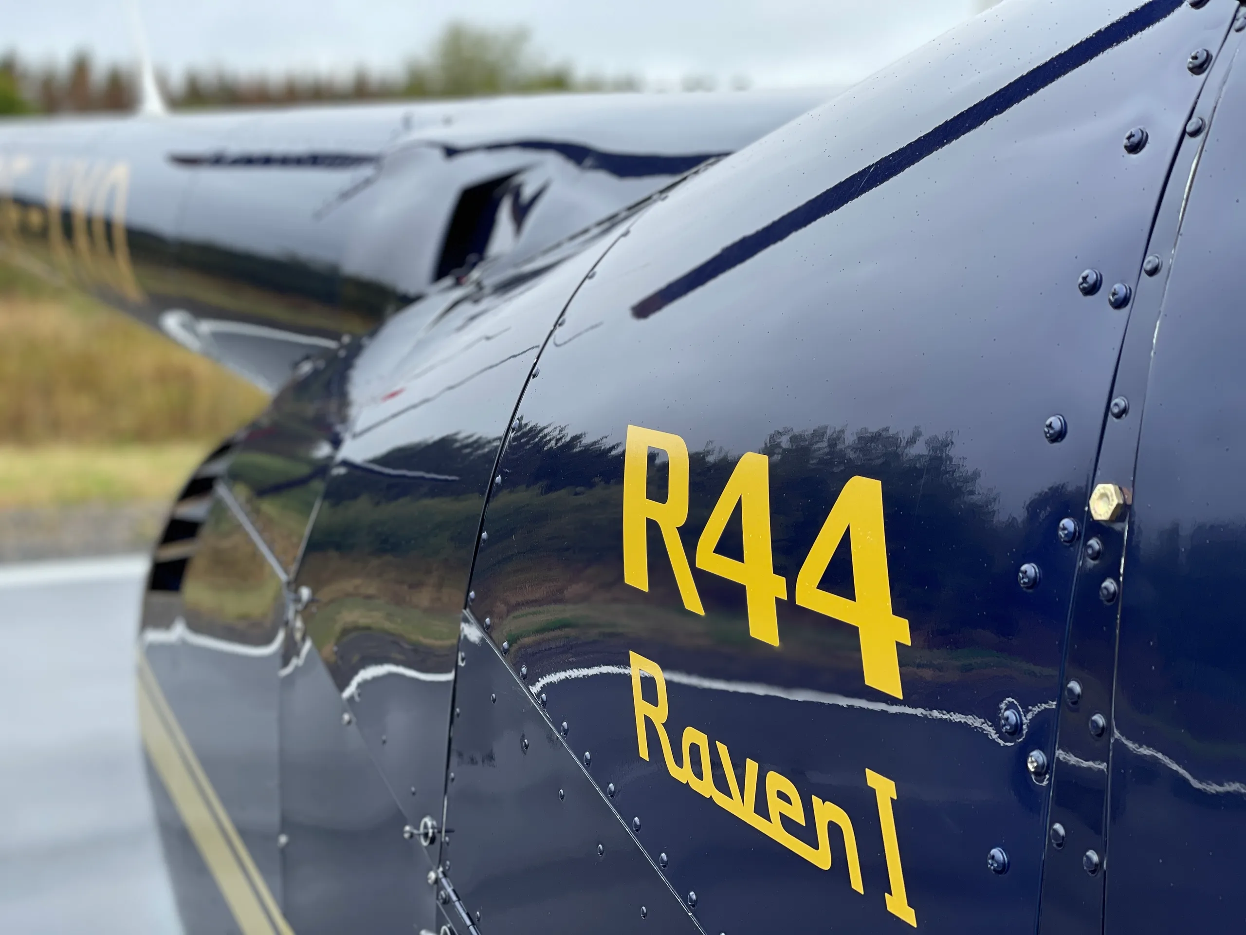 Close up of the R44 Raven I logo on the Robinson R44 Raven I OE-XXQ helicopter.