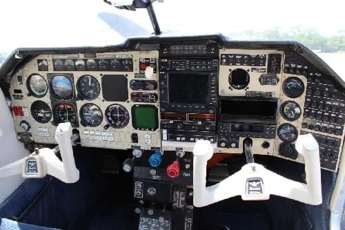 A close-up view of the aircraft's instrument panel and controls.