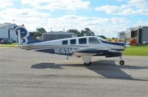 N563AP Bonanza aircraft parked on the tarmac, side view.