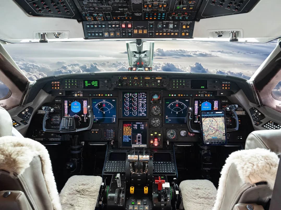 View of the aircraft cockpit with instrument panel and controls.