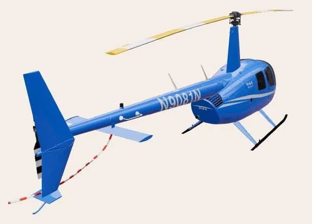 A blue Robinson R44 helicopter with registration N9081N, viewed from the rear-right side.