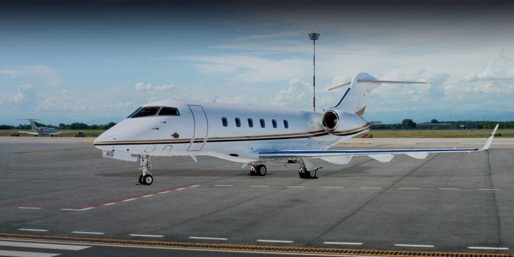 A Falcon aircraft parked on the tarmac.