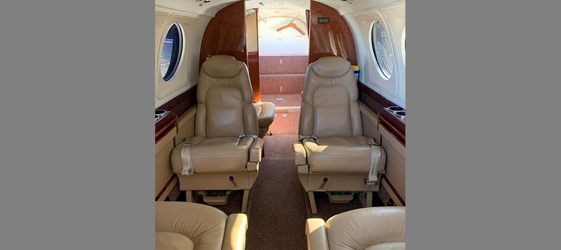 Interior view of the aircraft cabin with leather seats.