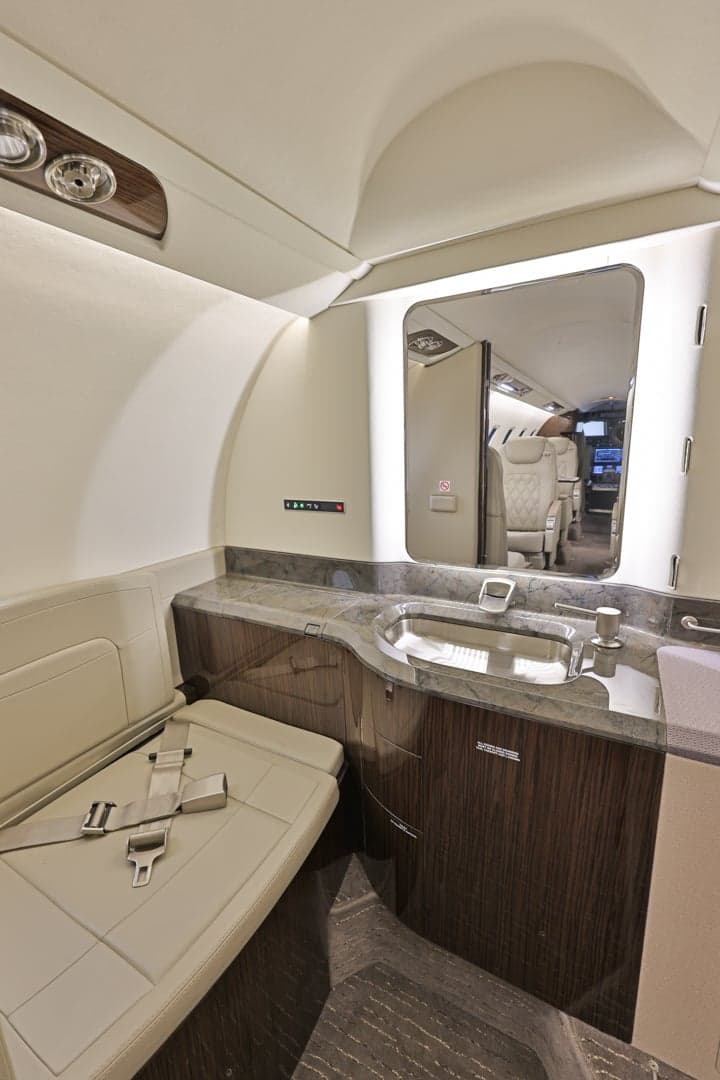 View of the Learjet 45XR lavatory with sink and seat.