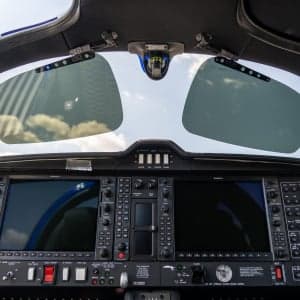 View of the cockpit instrument panel and sun visors of the aircraft.