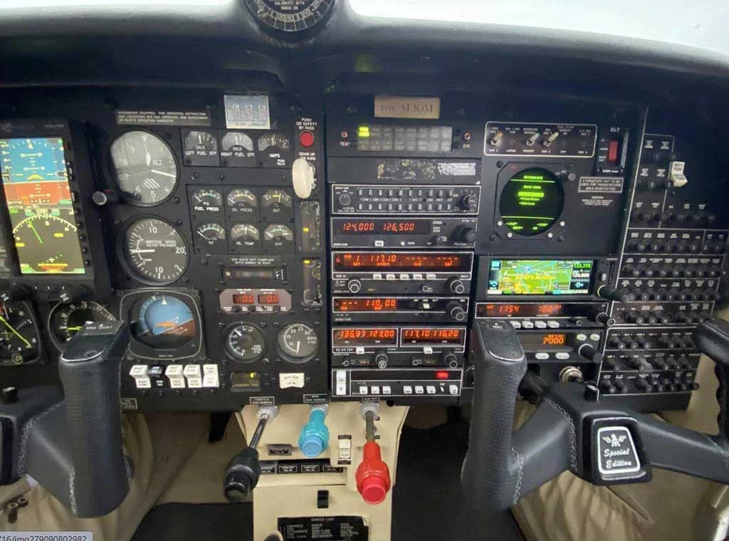 A close-up view of the aircraft's instrument panel, showing the avionics stack, gauges, and controls.