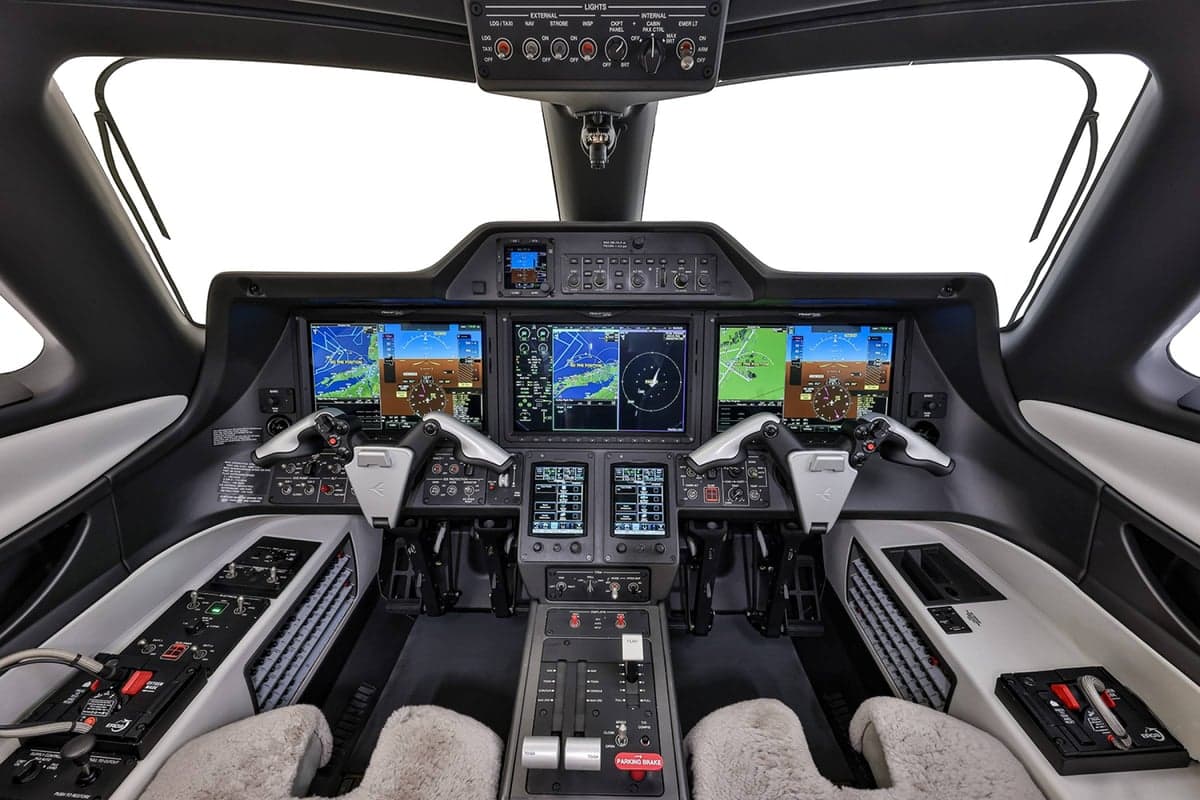 The Phenom 300E cockpit features advanced avionics and controls.