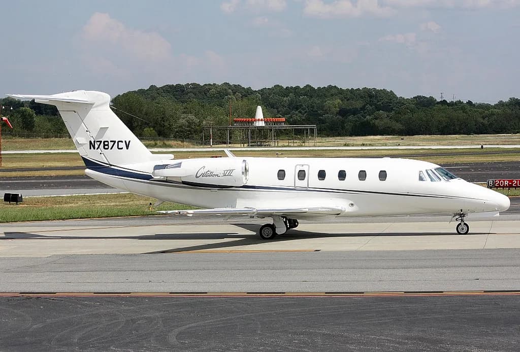 A Citation III aircraft with registration N787CV on the tarmac.