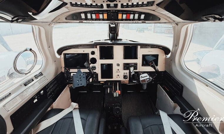 Wide view of the cockpit of a twin-engine aircraft.